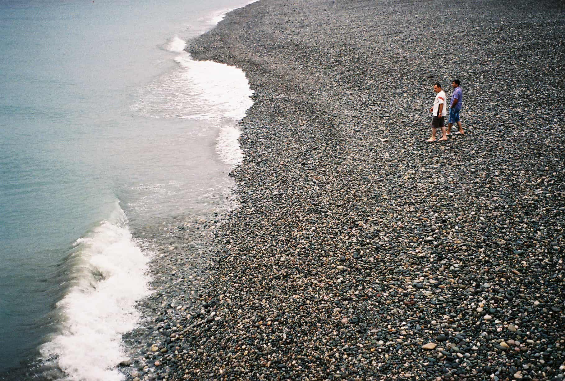 People Walk Batumi's Beach